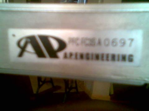 1991 Mazda RX-7 - Close-up of a label on a component, showing the AP Engineering logo and a product code.