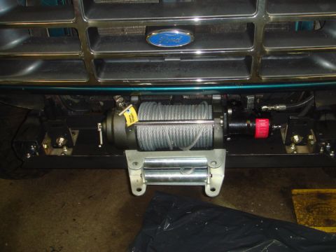1996 Ford Bronco - A winch is installed on the front of a 1992 Ford Bronco, below the grille.