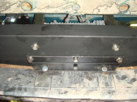 1996 Ford Bronco - Close-up of a winch mounting bracket and cable installation.