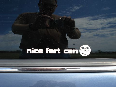 2000 Ford Crown Victoria - A sticker with text and an emoji is visible on the car window.
