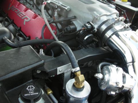 1998 Ford Crown Victoria - Close-up of a Viper engine bay, showing the red engine cover and polished intake components.