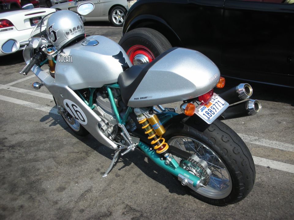 Silver Ducati motorcycle, number 16 on fairing, Paul Smart 1000 LE badge on tail, California plate 1889771