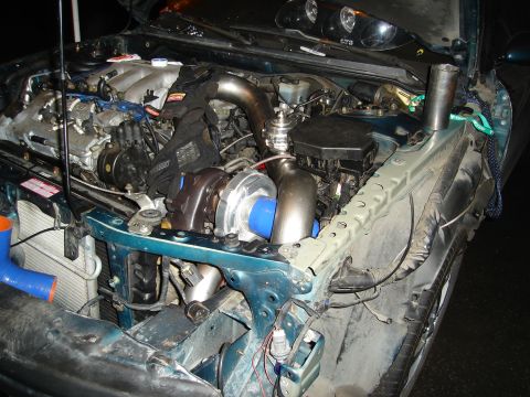 1995 Mazda MX-6 - Modified engine bay of a 1995 Mazda MX-6, a turbocharger and custom piping.