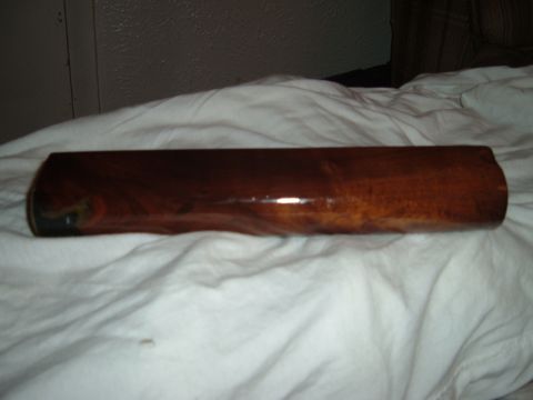 1919 Yugo Vega - A wooden trim piece with a glossy finish is shown against a white background.