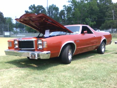 1979 Ford Ranchero - This 1979 Ford Ranchero is displayed with its hood open on a grassy field.