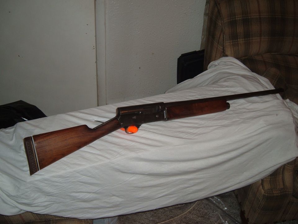 Wooden shotgun with orange trigger guard