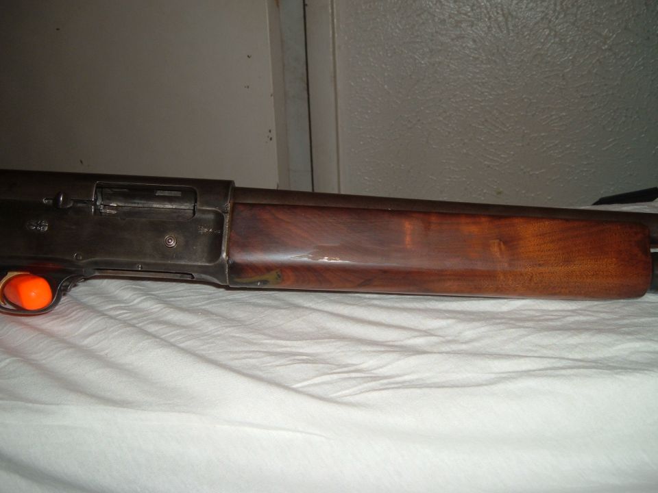 close-up of shotgun receiver and wooden stock
