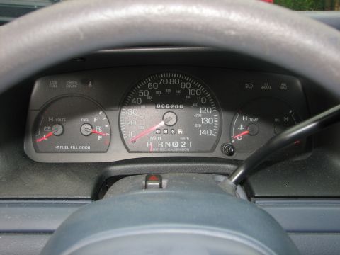 2000 Ford Crown Victoria - Dashboard of a 2000 Ford Crown Victoria showing the speedometer, fuel, and temperature gauges.