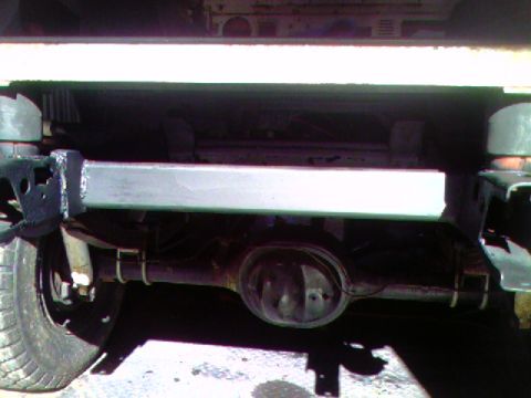 1974 Ford Bronco - Close-up view of the rear axle assembly, including the differential and suspension components.