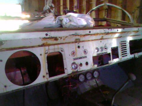 1974 Ford Bronco - This is a close-up of a rusted dashboard with various openings for gauges and controls.