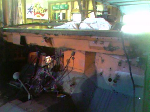 1974 Ford Bronco - Interior view of a vehicle under construction, revealing exposed wiring and dashboard components.