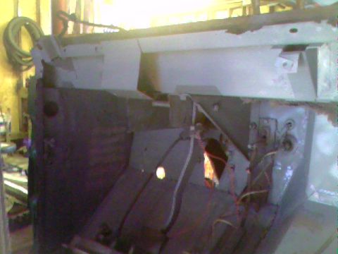 1974 Ford Bronco - The interior of a vehicle is shown, with exposed metal and wiring visible.