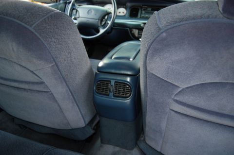 1985 Mercury Grand Marquis - View of the rear air vents and center console from the back seat of a car.