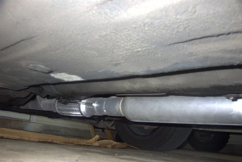 1994 Dodge Stealth - Underside view of a vehicle's exhaust system, showing a flex connector and muffler.