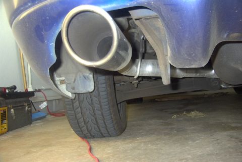 1994 Dodge Stealth - Rear view of a vehicle's exhaust system and tire.