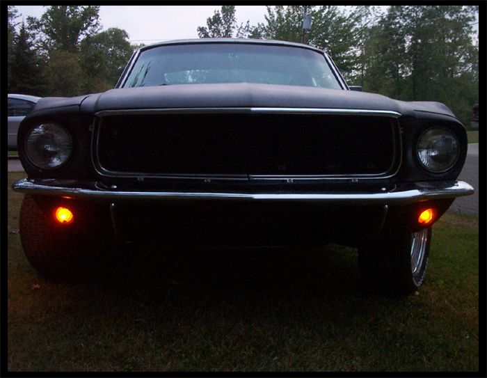 Black 1968 Ford Mustang front view with grille and headlights