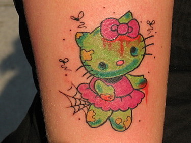 2001 Ford Crown Victoria - A tattoo of a zombie Hello Kitty character, complete with a spiderweb on its skirt.