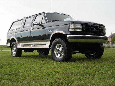 1995 Ford C-150 (Centurion Conversions) - This SUV has a two-tone paint scheme and prominent running boards.