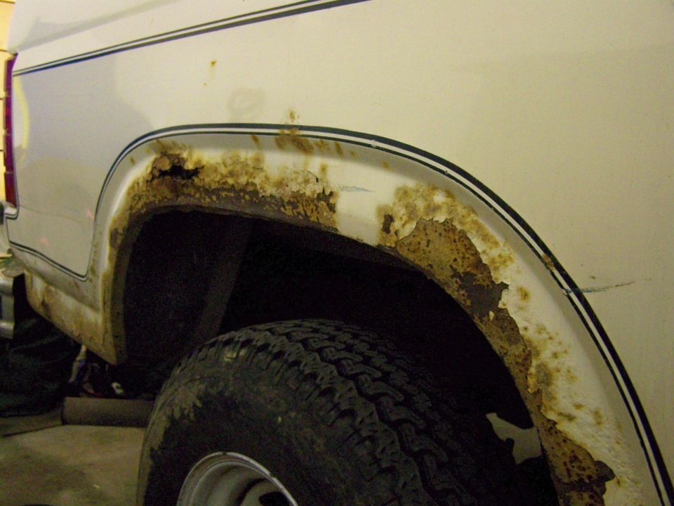 Passenger's side rear wheel well. Yes that is a hole rusted through.