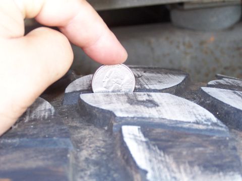 2007 Ford Bronco - A quarter is used to measure the tread depth of a tire.