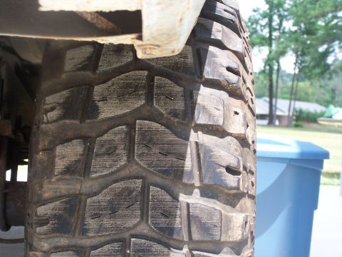 2007 Ford Bronco - Underside view of a vehicle's tire and fender assembly.