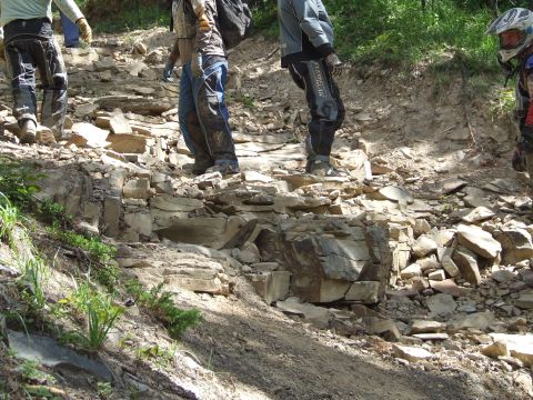 1990 Ford Bronco - Participants navigate a challenging rocky path during the Rocky Mountain Bronco Rally.
