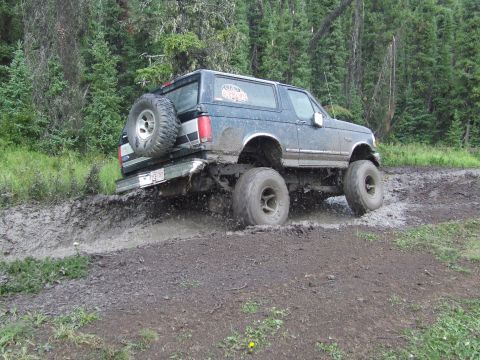 1990 Ford Bronco - This 1990 Ford Bronco navigates a muddy trail during an off-road event.