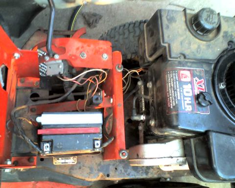 1965 Ford Mustang - Lawn mower engine detail showing the 10 HR XL engine and battery.