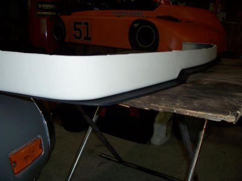 1989 BMW 3 Series - A white front bumper part is shown, with an orange reflector visible on the left side of the frame.