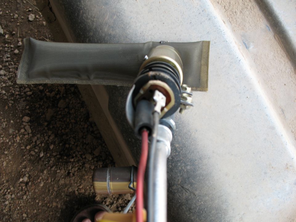 Fuel pump assembly with filter sock, removed from a vehicle