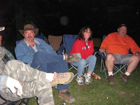 1995 Ford Bronco - People gathered around a campfire at night, enjoying the outdoors.