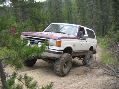 1995 Ford Bronco - This lifted 1995 Ford Bronco navigates a wooded trail during the Rocky Mountain Bronco Rally.