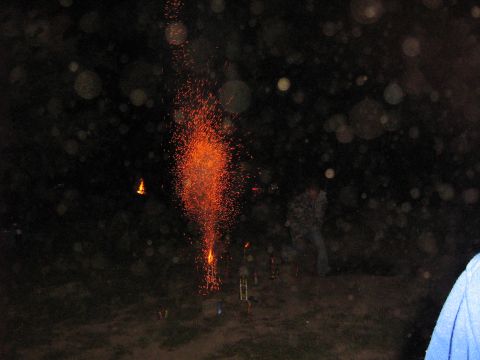 1995 Ford Bronco - A nighttime scene with fireworks illuminating the dark sky, with a Supermotors watermark at the bottom.
