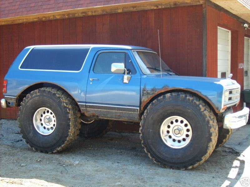 Lifted blue full-size Chevrolet K5 Blazer on large mud tires