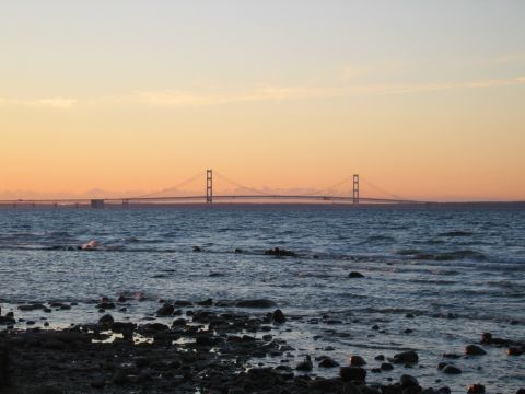 1971 Ford Ranchero - The Mackinac Bridge is visible in the distance during a colorful sunset over the water.