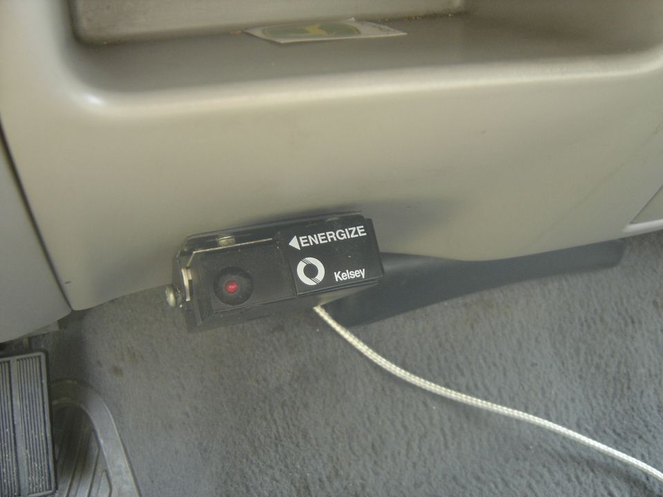 Kelsey trailer brake controller mounted under a tan truck dash with red indicator lit