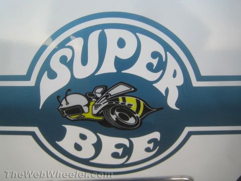1968 Ford Mustang - Close-up of a Super Bee emblem, a stylized bee and the words 'SUPER BEE'.