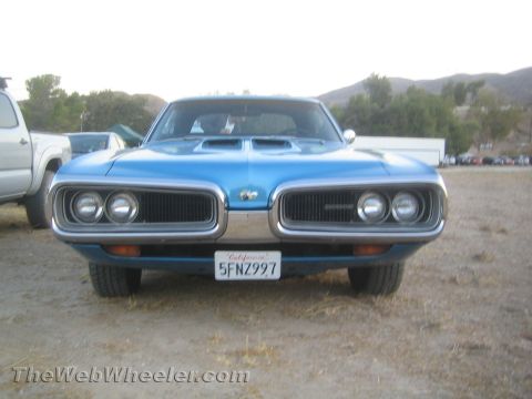 1968 Ford Mustang - This blue Dodge Coronet features a distinctive grille and dual headlights, typical of its model year.
