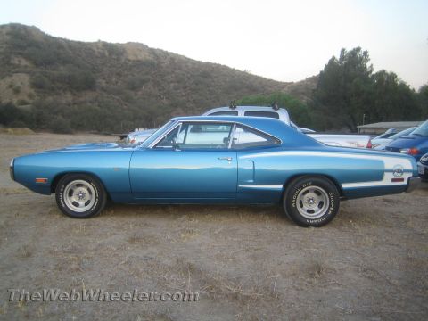 1968 Ford Mustang - A blue 1970 Dodge Super Bee is parked outdoors with other vehicles visible behind it.