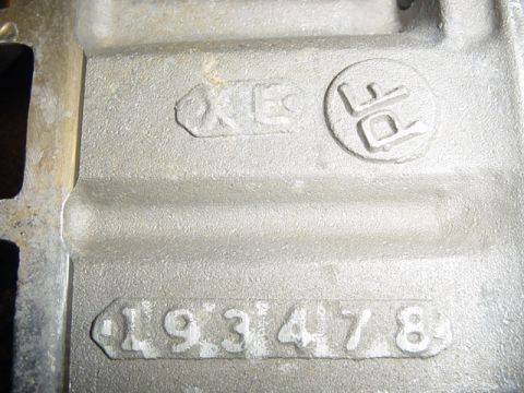 1979 Ford F-150 - Close-up of a cast metal part showing embossed alphanumeric and numeric identifiers.
