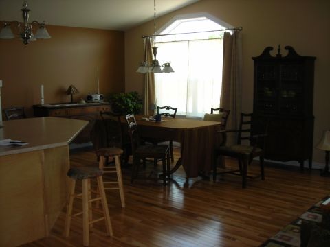 1984 Ford Bronco - A dining room scene with a table set for a meal and a view of a kitchen island.
