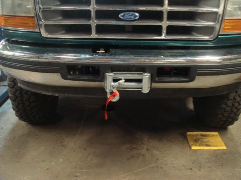 1996 Ford Bronco - Front view of a 1996 Ford Bronco showing a winch installed in the bumper.