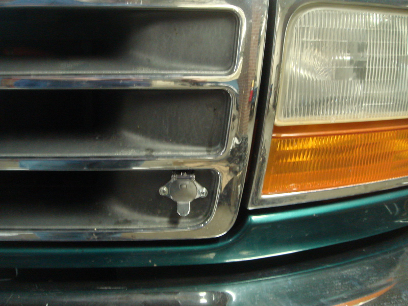 1996 Ford Bronco grille with chrome trim and a trailer connector installed