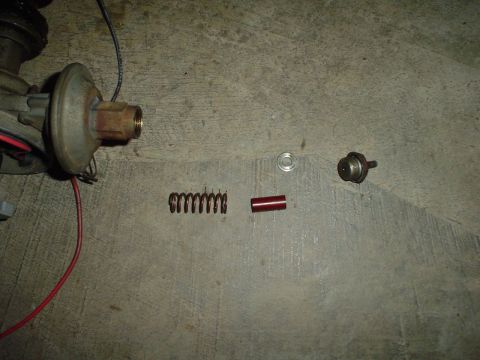 1967 Ford F-250 - Disassembled distributor components laid out on a concrete surface.