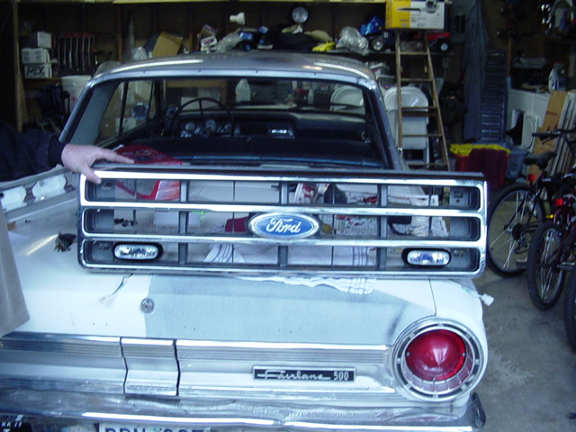 There they are mounted to the grille