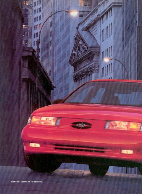 1993 Ford Taurus - A red 1992 Ford Taurus is shown from the front in an urban setting.