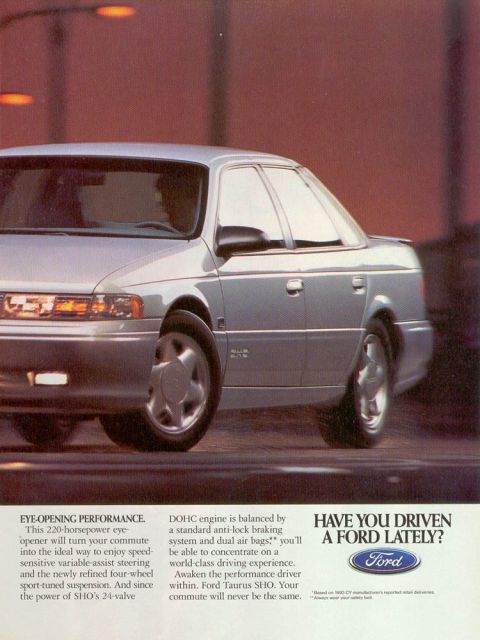 1993 Ford Taurus - This 1993 Ford Taurus SHO sedan is shown in a 3/4 front view with motion blur on its wheels.