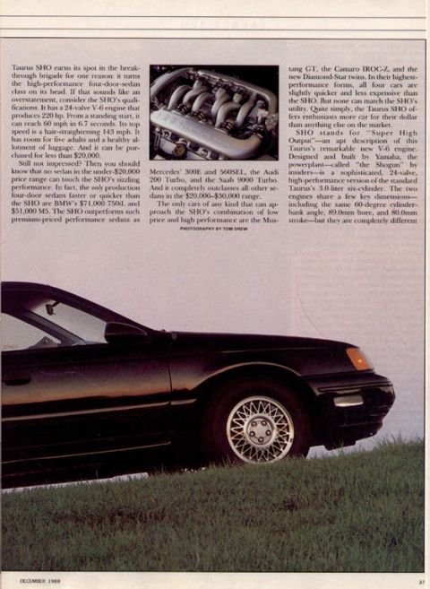 1993 Ford Taurus - This 1993 Ford Taurus SHO is shown from a 3/4 front angle, parked on a grassy hill.