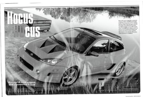 1993 Ford Taurus - This modified Ford Focus features a custom body kit and hood scoops, suggesting a performance-oriented build.