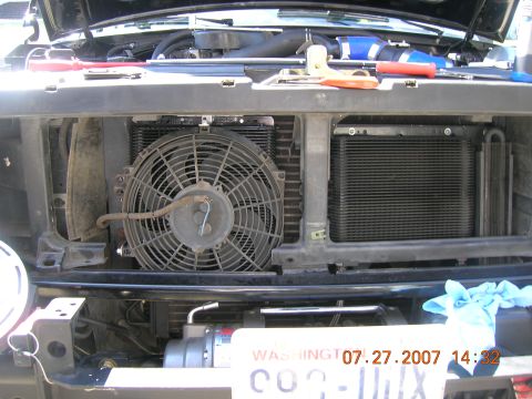 1996 Ford Bronco - Close-up of a vehicle's engine bay, revealing the radiator, fan, and other components.